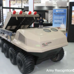 Image of the AGEMA Unmanned Ground Vehicle (UGV) with the MSP WarbleFLY loitering Munition Multi-Launcher Payload attached